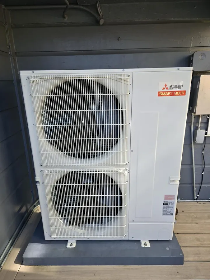 Mitsubishi Electric outdoor unit beside a home